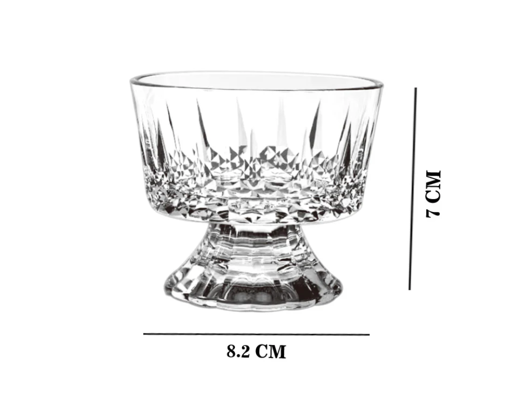Clear glass with decorative base and height measurement on a white background